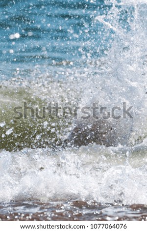 The vertical view of big wave on the sea  with a lot of foam. fake color. Copy space. Concept of travel. 