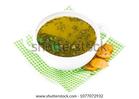 Chicken broth with herbs and spices. Studio Photo