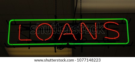 Neon Loan Sign in Store Window