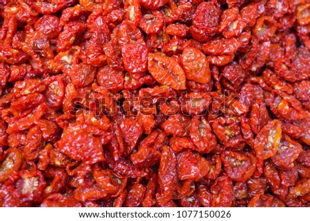 Sun dried tomatoes in the vegetable market. Traditional italian ingredients.