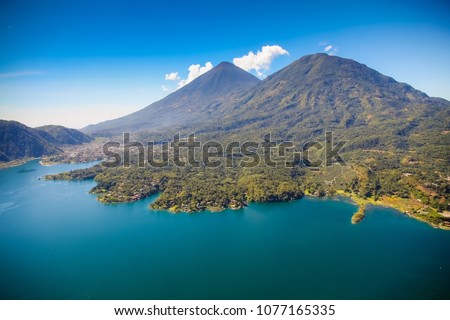 Aerial view of the area of Santiago Atitlan in Sololá Guatemala. On the back, Atitlán Volcano. Royalty-Free Stock Photo #1077165335
