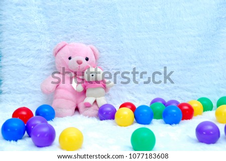 panda dolls and color balls on the white background