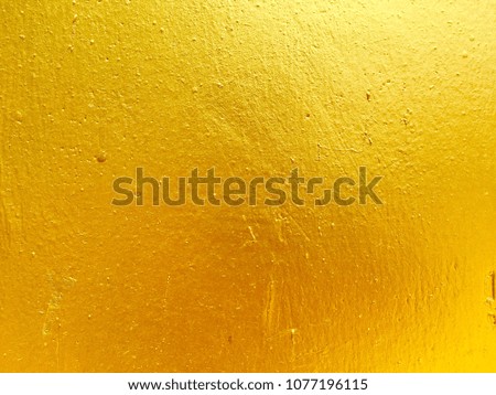 Gold color concrete wall background for texture design