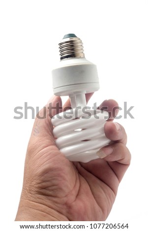 Hand holding energy saving lamp on white background