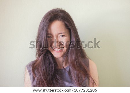 soft focus. happy cheerful young asian woman.beautiful girl looking at camera with joyful and charming smile relaxing. people freedom style concept