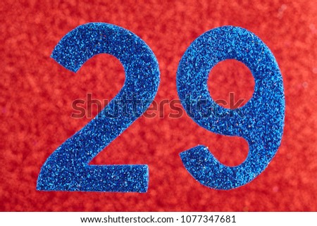 Number twenty-nine blue color over a red background. Anniversary. Horizontal