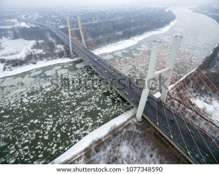 Winter season aerial from a drone of a bridge in Warsaw over the river