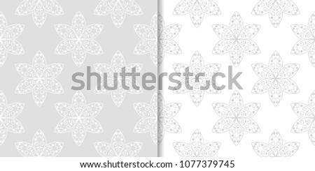 Light gray floral ornamental designs. Set of seamless patterns for textile and wallpapers