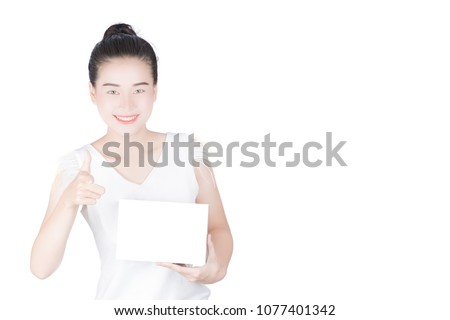 Woman holds the product for presentation. Lady  beautiful  in white shirt girl advertising your product on blank white sign board. Asian female model isolated on white background.
