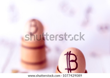 Egg with bitcoin in a wooden small barrel