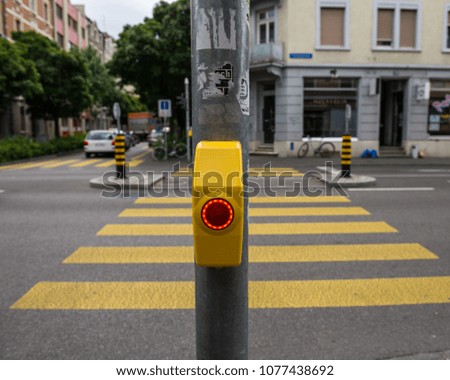 switch at the pedestrian crossing in the city. Swiss city Basel in the summer. Europe.