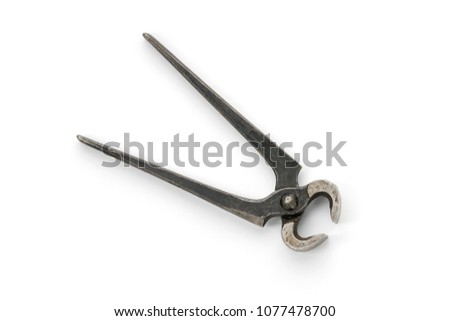 old grungy pincer pliers, isolated on white Royalty-Free Stock Photo #1077478700