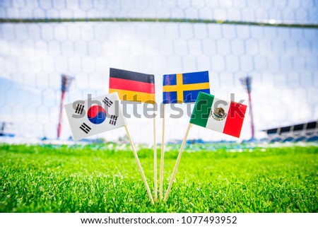 Group F - Germany, Mexico, Sweden, Korea Republic, South Korea - National Flags on green grass on football stadium Royalty-Free Stock Photo #1077493952