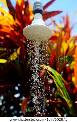 high speed water from shower head  noozle on blurred backgroundd Royalty-Free Stock Photo #1077502871