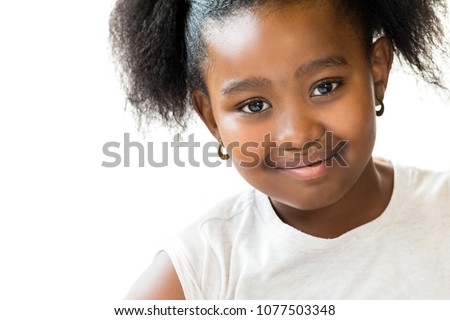 Macro close up portrait of attractive little ponytailed african girl.Isolated on white background.