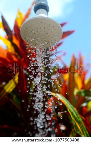 high speed water from shower head  noozle on blurred backgroundd Royalty-Free Stock Photo #1077503408