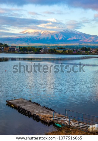 Panorama image of Mount Fuji and Lake pier,Kawaguchi with Kawaguchiko Ohashi bridge on morning time.(vertical)