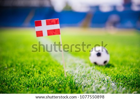 Denmark national Flag and football ball on green grass. Fans, support photo, edit space. Original wallpaper for World cup in Russia 2018.