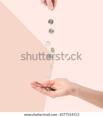 Female hands and falling coins on white background. Coins in palm