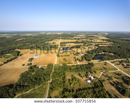 Aerial view of farm fields and trees in mid-west Missouri early morning