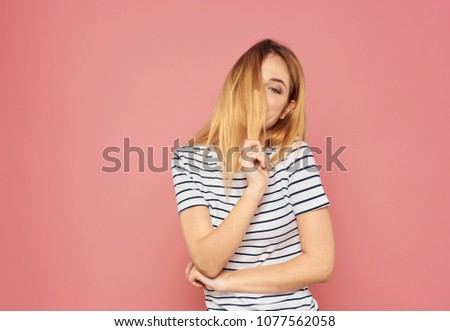 blonde on a pink background, long hair                      