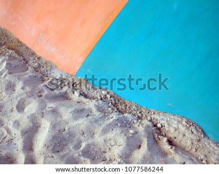 colorful plastic pvc inflatable contrasting with white sand silica