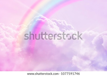 magic rainbow fantasy cloud background  fluffy sky white landscape with sunny rays. Pastel colors dreams unicorn concept Royalty-Free Stock Photo #1077591746