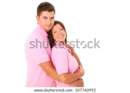 A picture of a young happy couple hugging over white background