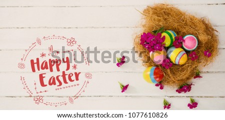 Happy Easter red logo against a white background against multicolored easter eggs in nest