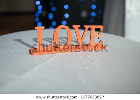 Foam letters LOVE. Standing on table indoor