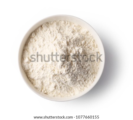 bowl of flour isolated on white background, top view Royalty-Free Stock Photo #1077660155