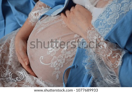 Pregnant woman holding on stomach