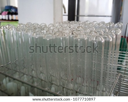 Laboratory test tube, Equipment for science hang on aluminium rack. blurred image for background.