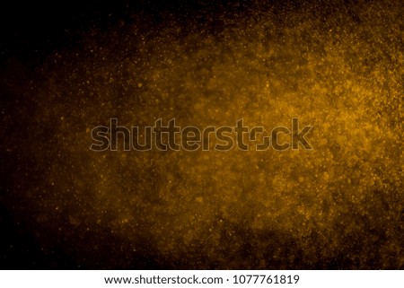 Gold bokeh on black background