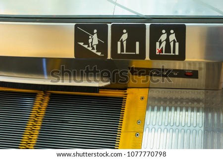 escalator Security,Signs on an escalator, warning signs,
