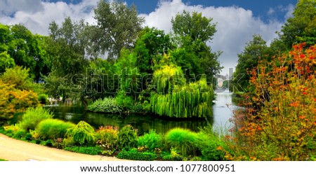 St. James's Park  is in front of Buckingham Palace and a lovely place for a stroll. Royalty-Free Stock Photo #1077800951