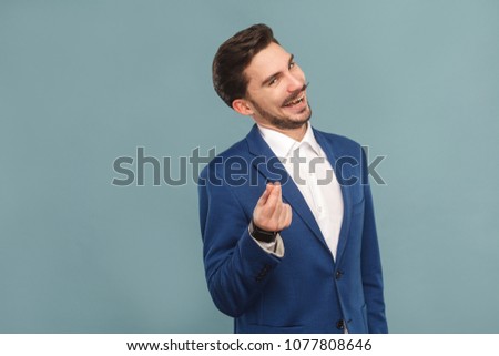 Give me money. Foxy businessman toothy smiling . Business people concept, richly and success. Indoor, studio shot on light blue background