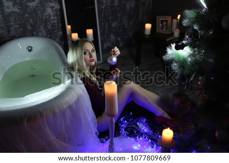 blonde in bathroom with candles