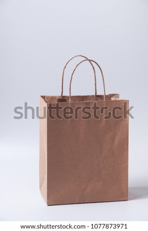 Brown shopping bag on gray background

