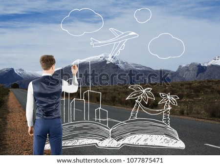 Man drawing travel icons on the road