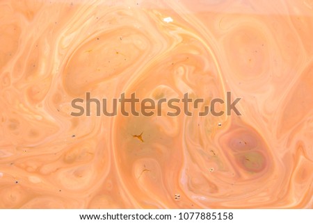 Abstract psychedelic paints. Multicolored colors are slowly poured into the milk pattern at a slow pace. Colorful abstract background for the designer