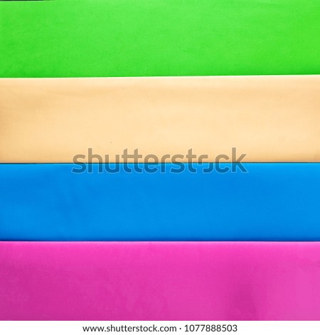 Multi colored abstract paper  pastel colors, with geometric shape, flat lay. 
