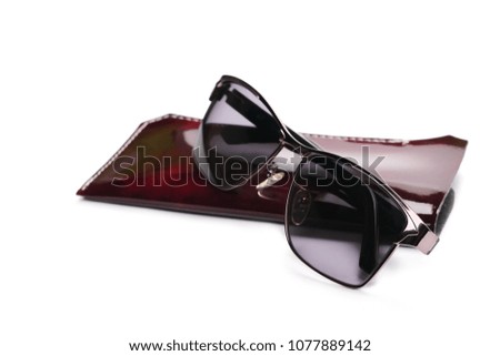 Sunglasses on case isolated on white