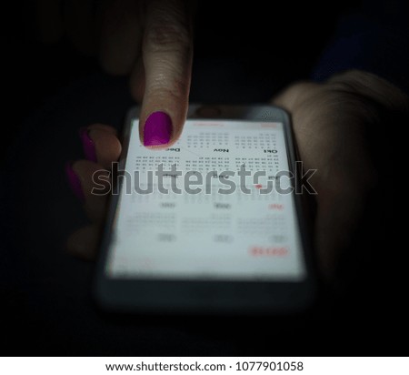 Finger on smartphone