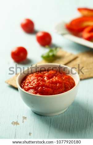 Baked capsicum and tomato dip with vegetable and crisps