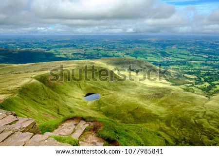 Walking the Scenic Brecon Beacons National Park in south Wales on a summers day.  Royalty-Free Stock Photo #1077985841