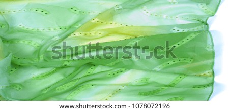 Silk fabric texture, background. green and yellow color