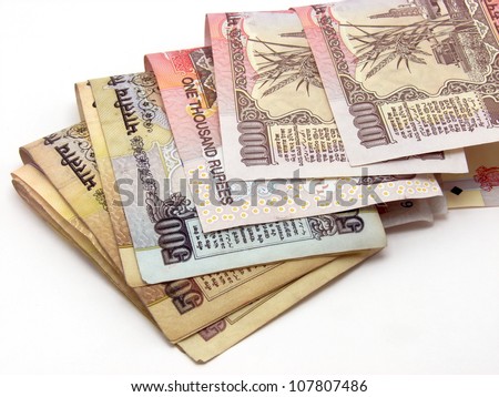 Image showing folded Indian notes of 500 & 1000 Rs. Both these currencies were obsolete after demonetization in India. Royalty-Free Stock Photo #107807486