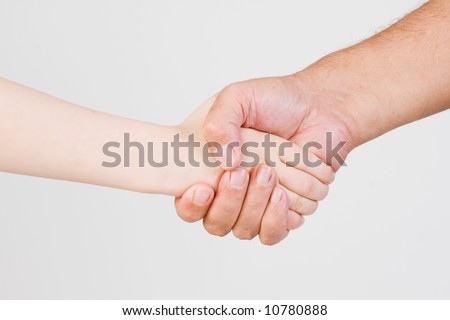 handshake between child and adult