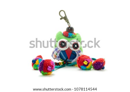 key ring with pretty green ball and bear doll White background